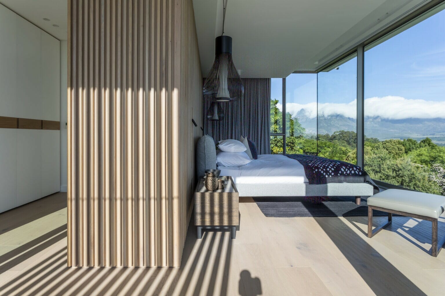 Timber slats on the bedroom wall for sophisticated finish, with panoramic views of Somerset West