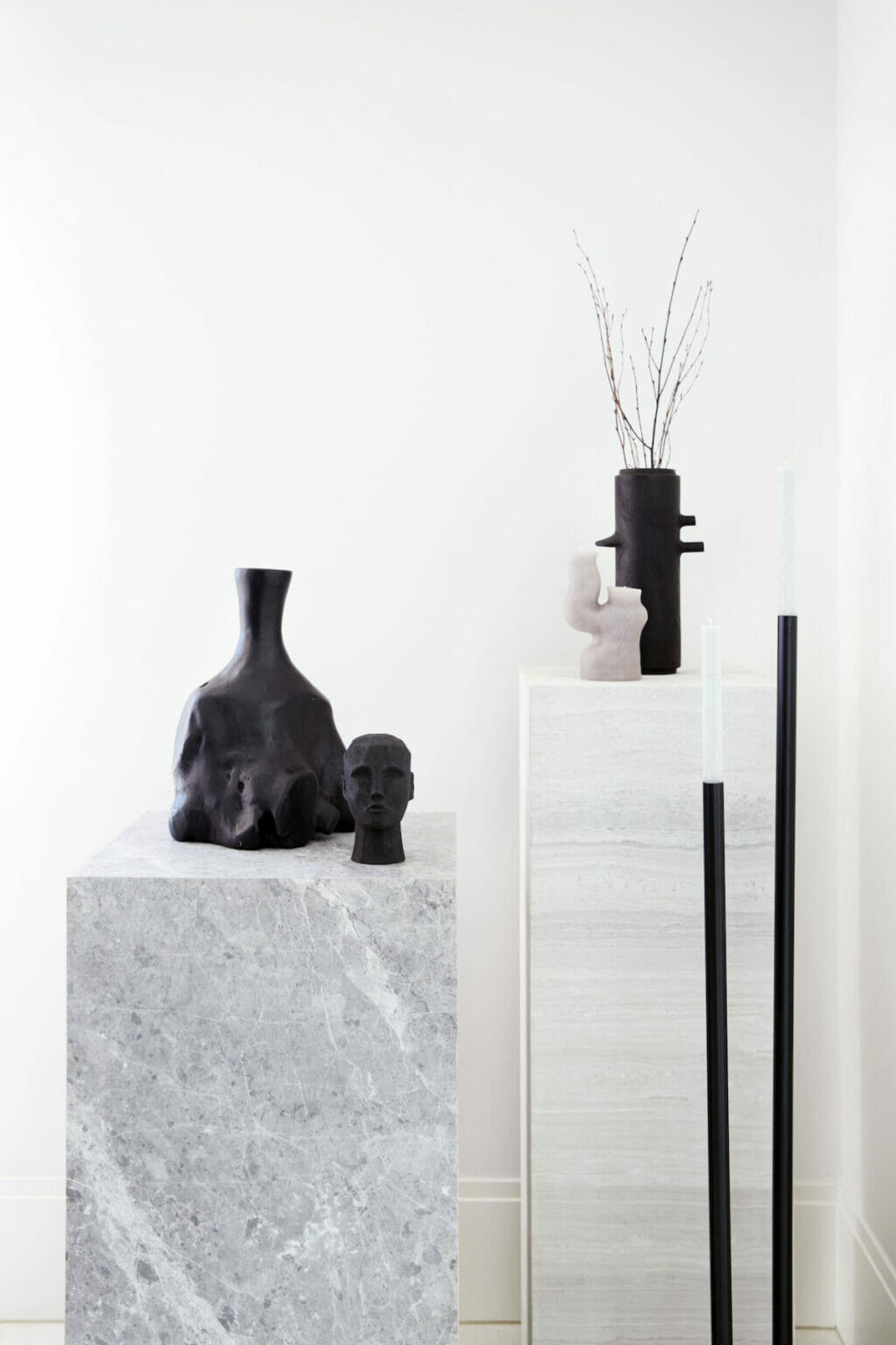 Stone plinths adorned with unique decor items from Weylandts